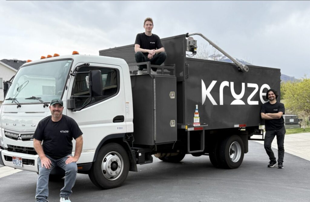 Kruze junk removal team with waste collection truck